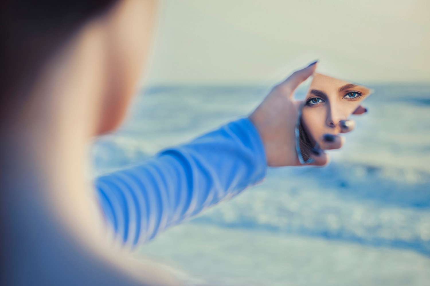 woman-being-introspective-in-mirror